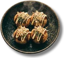Takoyaki — battered octopus balls with bonito, green onion and spicy mayo